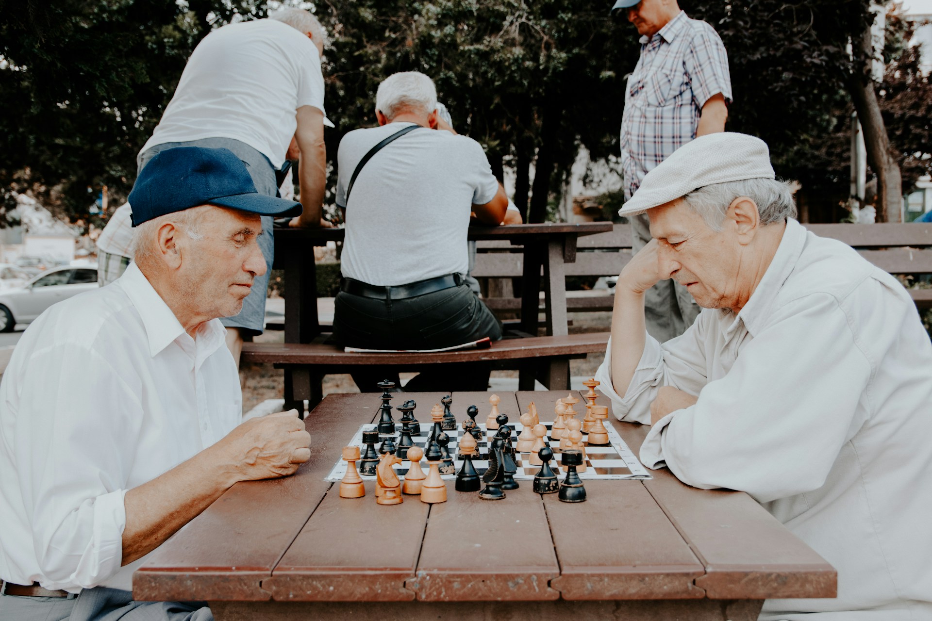 Two seniors playing chess together, symbolizing the importance of thoughtful planning for future healthcare needs, as discussed in Medicaid planning strategies.